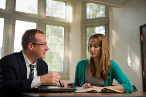 Sept. 29, 2011; Jim Delaney works with a graduate student...Photo by Matt Cashore/University of Notre Dame
